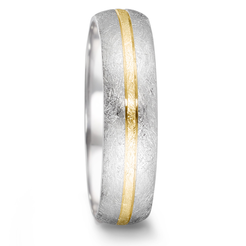 Partnerring Der Tamor Ring aus der TeNo Partner Kollektion ist das perfekte Symbol für Freundschaft, Liebe und Partnerschaft jeglicher Konstellation. Mit einer Breite von 6 mm und eismattierter Oberfläche ist er das perfekte Geschenk und bleibendes Zeichen der Verbundenheit. Dieser Ring wird in Deutschland aus Edelstahl und 750/18 K Gelbgold gefertigt. Das handwerkliche Können des Feinschmieds und die aufwendige Eismattierung verleihen ihm eine besondere Note. 068.2500.D56.XX