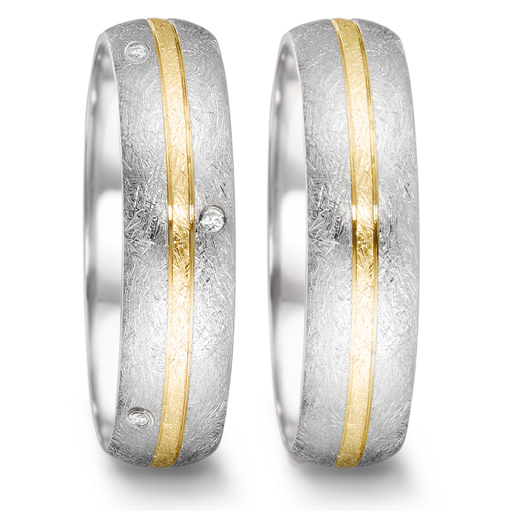 Partnerring Der Partnerring aus der Tamor Kollektion von TeNo vereint puristisches Design mit zeitloser Eleganz. Der Ring besteht aus Edelstahl und 750/18 K Gelbgold in einem eismatten Finish. Er ist ringsum mit 8 Vollschliff Diamanten besetzt, die dem Ring das gewisse Etwas verleihen und für einen Hauch von Luxus sorgen. Durch das eismatte Finish erhält jeder Ring eine individuelle Struktur und wird durch die erfahrene Hand des Feinschmieds zum Unikat! 068.25S01.D56.XX