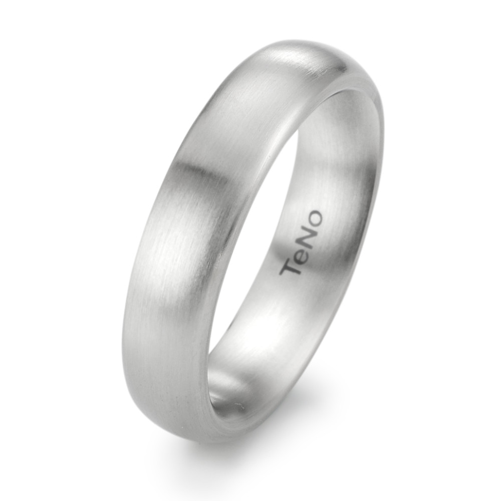 Fingerring Dieser Fingerring aus Edelstahl präsentiert sich in einem matten Finish. Das schlichte und glatte Design strahlt zeitgemässe Eleganz aus und macht diesen Ring zu einem idealen Accessoire für den täglichen Gebrauch. Die Marke "TENO" steht für Qualität, Made in Germany. Ein pflegeleichter Ring, der sich ausserdem durch seine Langlebigkeit und Hautfreundlichkeit auszeichnet. 069.0600.XX