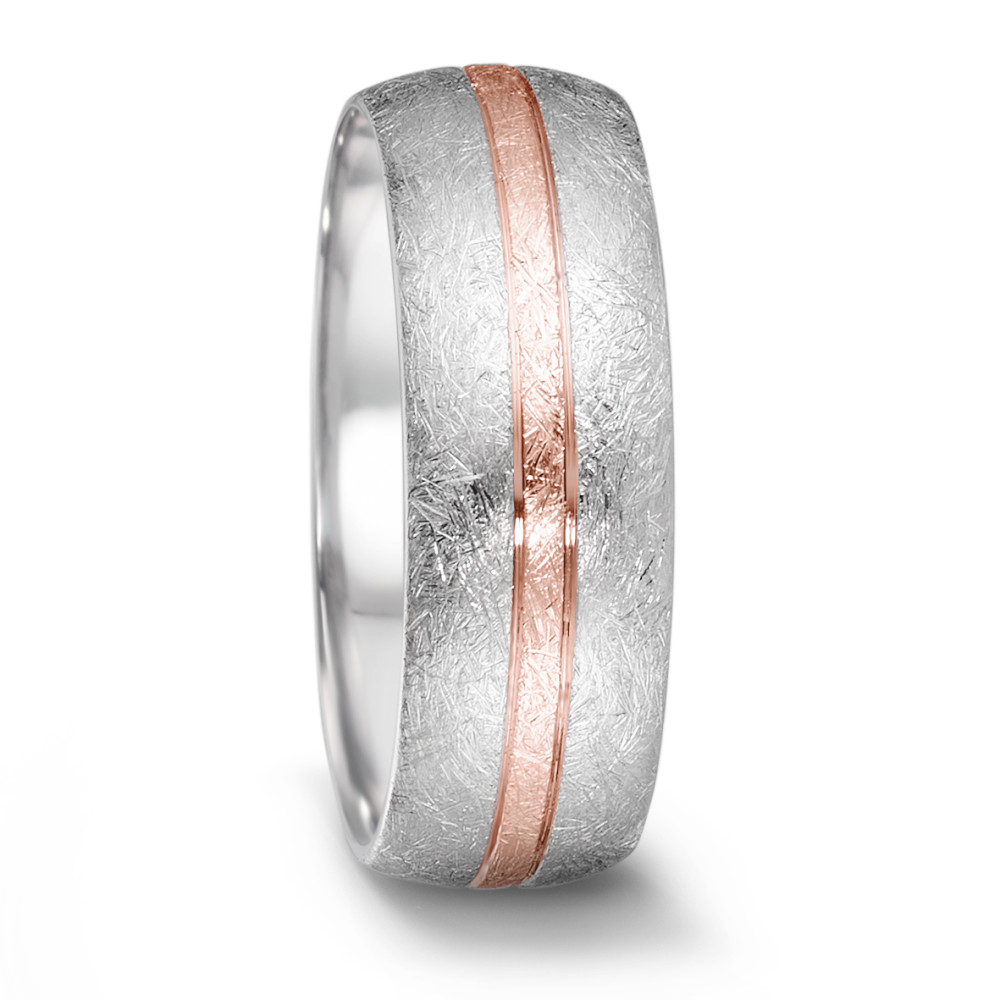 Fingerring Dieser stilvolle Ring aus der Tamor Partner Kollektion von TeNo verleiht jedem Outfit das gewisse Extra und ist ein wahrer Hingucker. Die eismatte Oberfläche in Kombination mit dem roségoldenen Streifen verleiht dem Ring eine subtile, aber dennoch markante Note, die Einzigartigkeit unterstreicht. Ob als Symbol für Beständigkeit in einer Beziehung oder als individuelles Style Statement - dieser Ring ist die perfekte Wahl für moderne Menschen mit gehobenen Ansprüchen. 068.2600.D56RG.XX