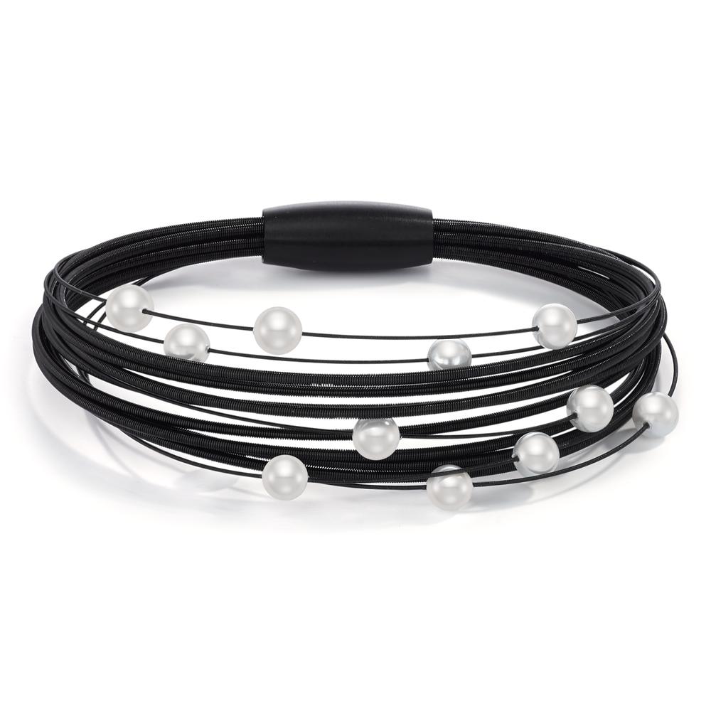 Armband Black & White mit maximalem Wow-Effekt: Dieser Arya Spiralarmreif überzeugt mit seinem schlichten und schnörkellosen Design. Die klassisch weissen Muschelperlen auf den schwarzen und flexiblen Edelstahlspiralen sind Inbegriff dieses eleganten, zeitlosen Schmuckstücks. Mit einem praktischen Magnetverschluss ausgestattet kann es im Handumdrehen einfach und sicher angelegt werden. 