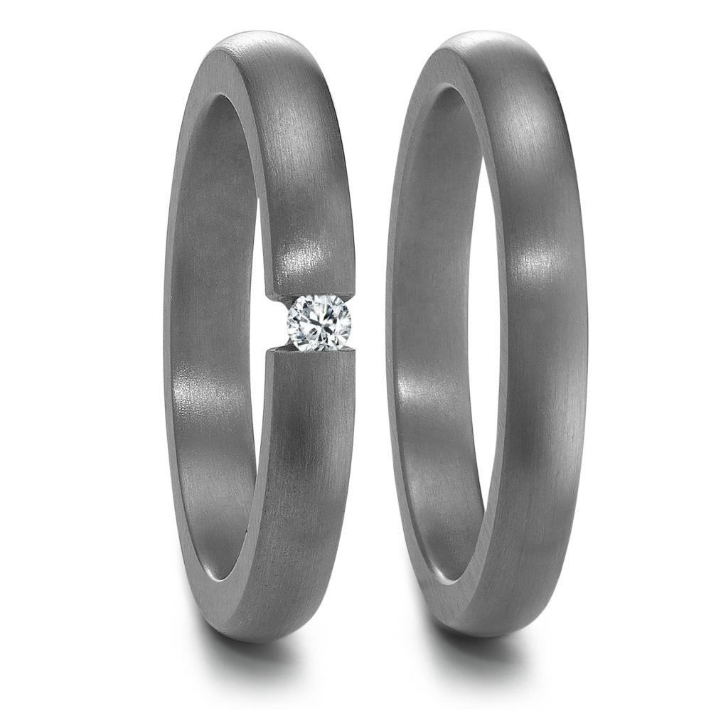 Partnerring Edler Damen-Partnerring aus 999 Tantal mit mattem Finish. Setzt durch einen funkelnden Diamanten in der Mitte ein unvergessliches Highlight. Zeitloses Design für den besonderen Moment – symbolisiert Liebe und Zusammengehörigkeit auf stilvolle Weise.