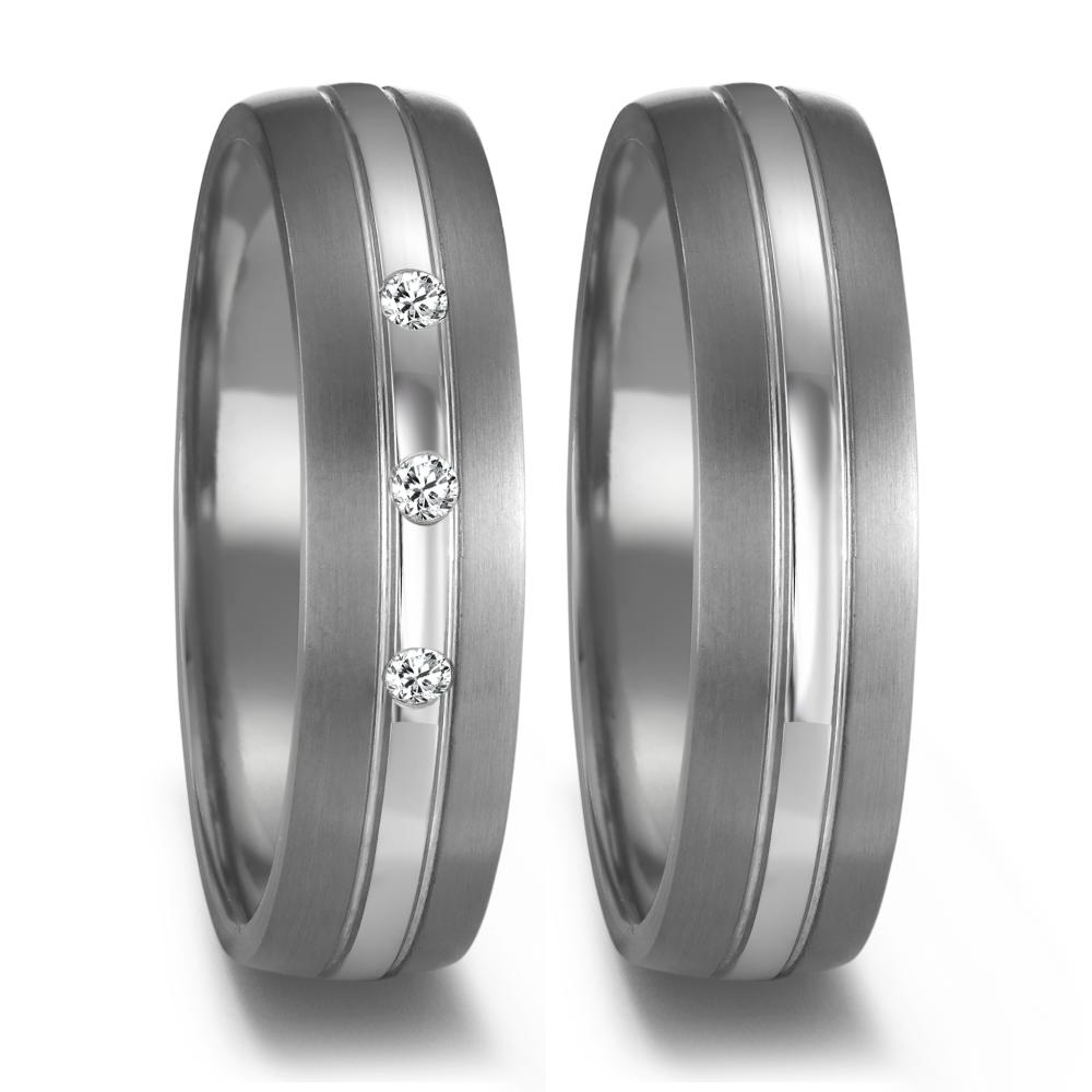 Partnerring Edler Damen-Partnerring aus 999 Tantal und 950 Platin, veredelt mit drei funkelnden Diamanten. Modernes Design trifft auf höchste Qualität – ein Symbol für Liebe und Verbundenheit. Perfekt für besondere Momente und ein Leben lang tragbar. 52678/001/009/XP02