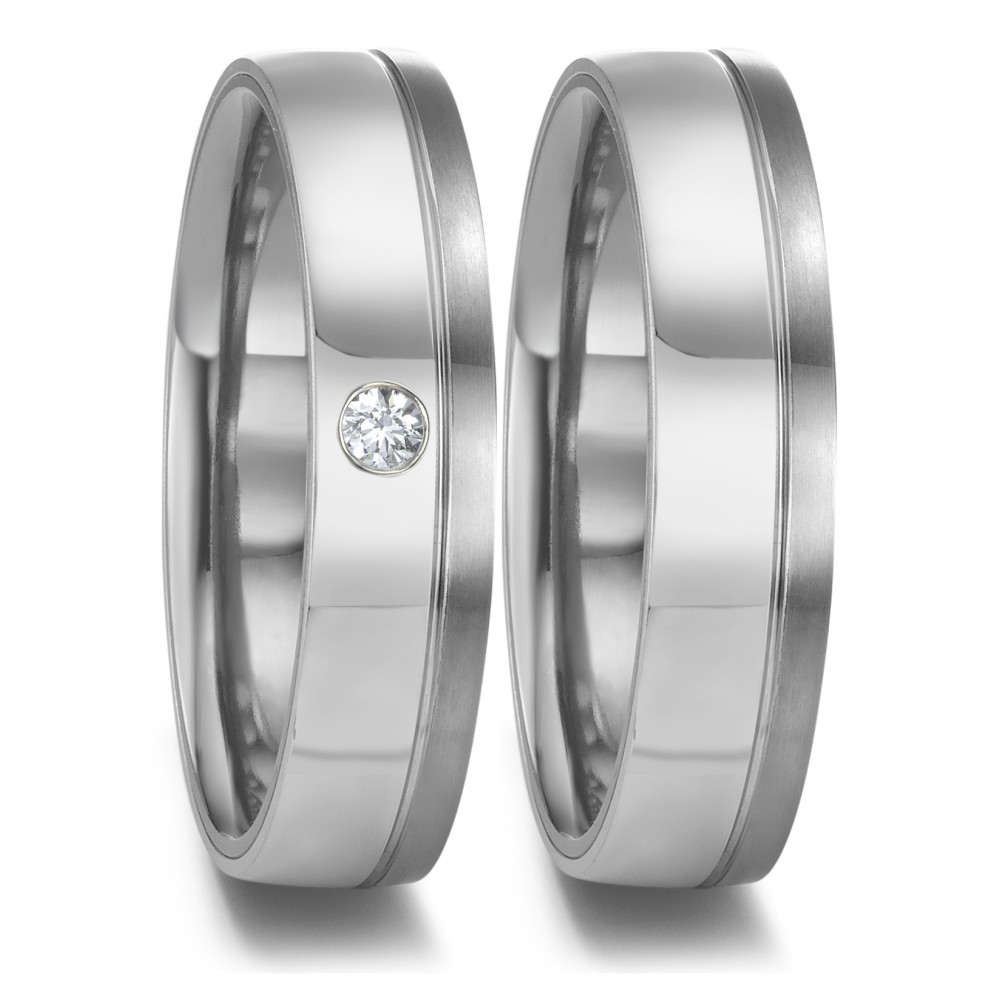 Partnerring Eleganter Damen-Partnerring aus robustem Tantal mit edlen Platin-Details. Ein strahlender Diamant ist dezent eingefasst und verleiht dem Ring eine zeitlose Eleganz. Perfekt für den besonderen Moment – stilvoll, langlebig und einzigartig. 52679/001/004/XP02